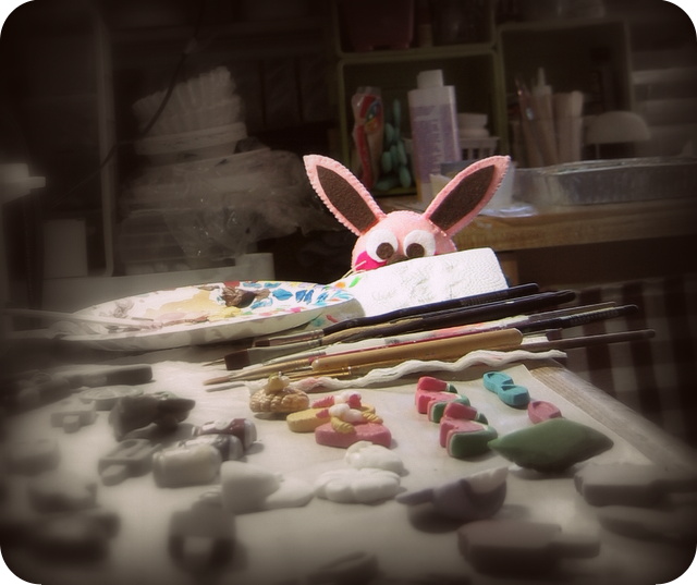 Ralphie peeking from behind the resin pieces