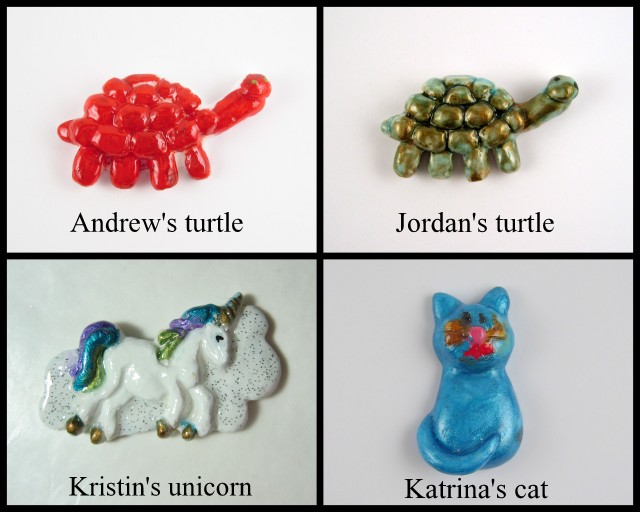 Kid's artwork, turtles, unicorn, and a cat