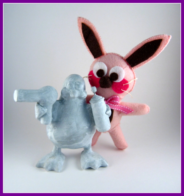 Ralphie the bunny with penguin sculpture coated with gesso