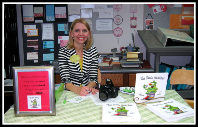 Emily Waisanen at her book signing table at the "Tour the Town" Art Walk